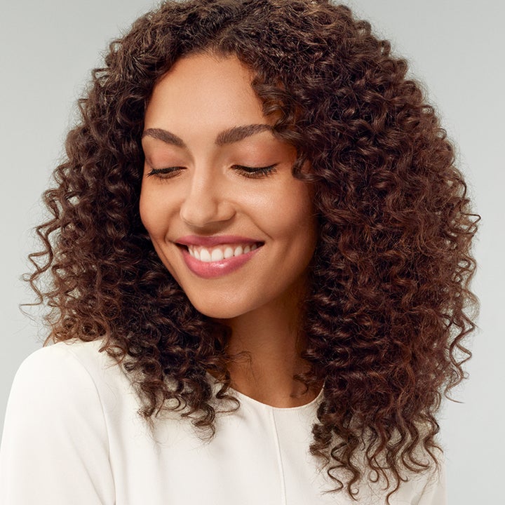 Model with healthy looking curly hair