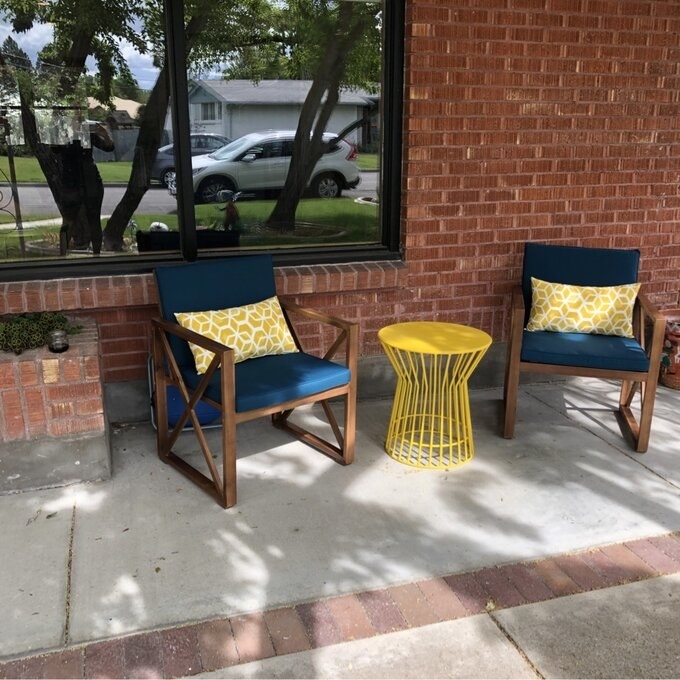 a reviewer&#x27;s yellow table on an outdoor patio