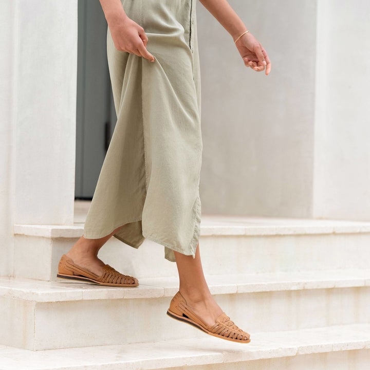Model wearing Nisolo Huarache sandals