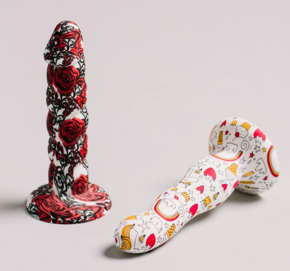 Two dildos with round bases and wavy shapes 