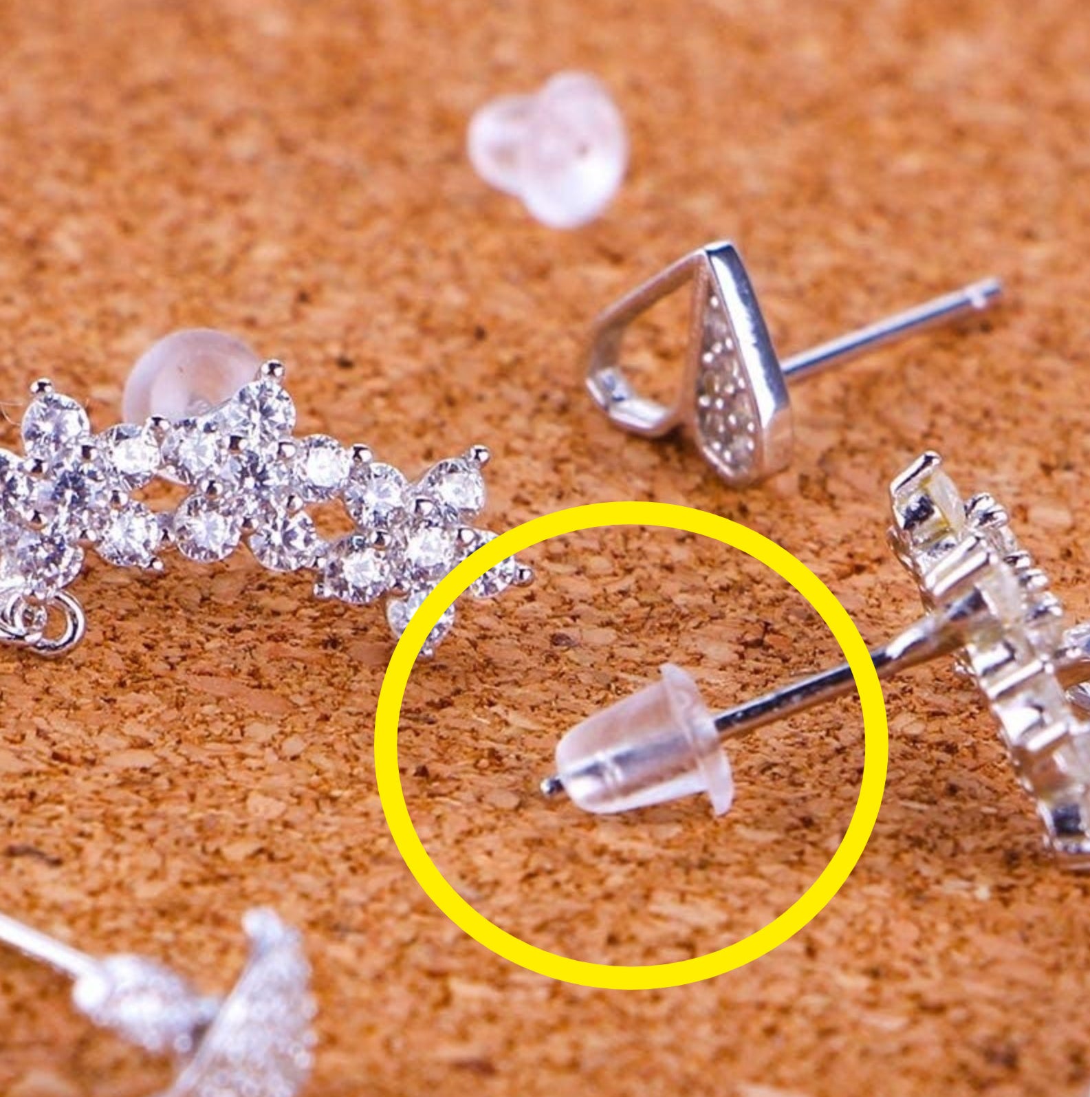 Plastic earring backs attached to several studs