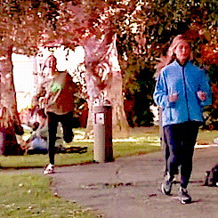 Phoebe from Friends running excitedly 