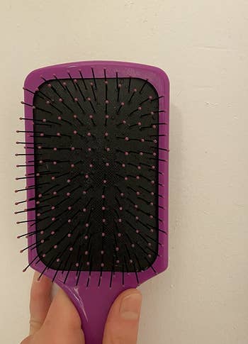 a reviewer photo of the same brush with all the hair removed 