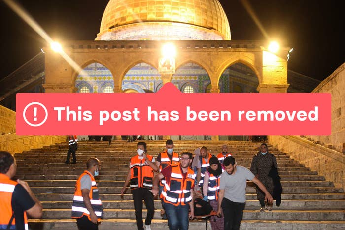 A photo of Palestinian medics evacuate a wounded person during clashes between Israeli security forces and Palestinian protesters in Jerusalem's Al-Aqsa Mosque compound on May 10, 2021, with the words "This post has been removed" overlayed