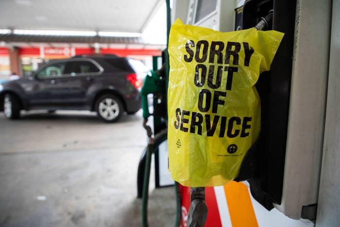 A gas pump with a bag that says &quot;Sorry out of service&quot;