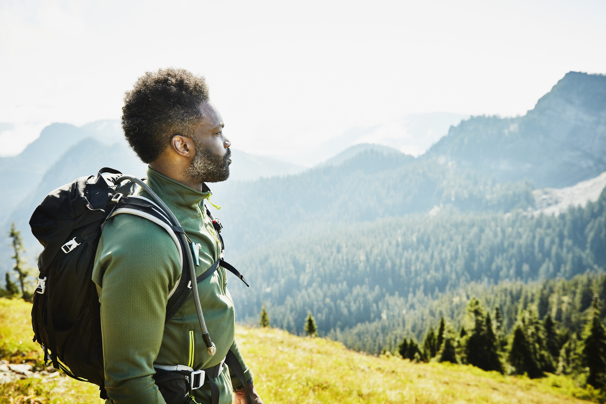 Man looking at mountain view during hike