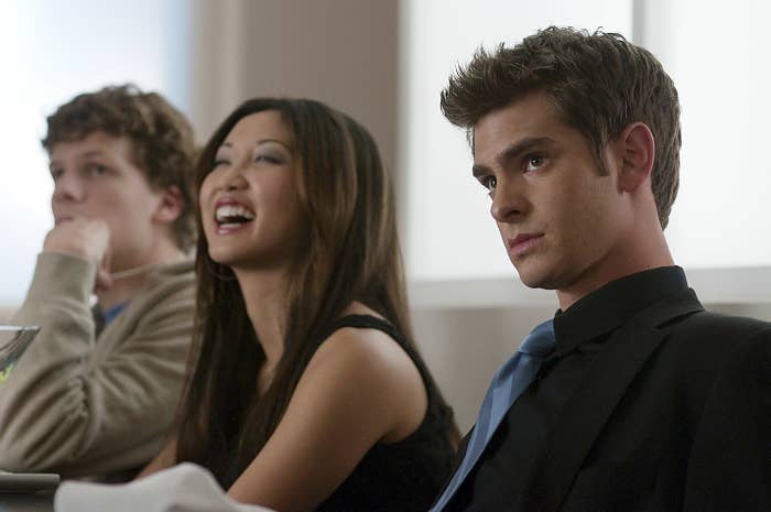 Mark, Chrissy, and Eduardo sitting at a table in The Social Network 