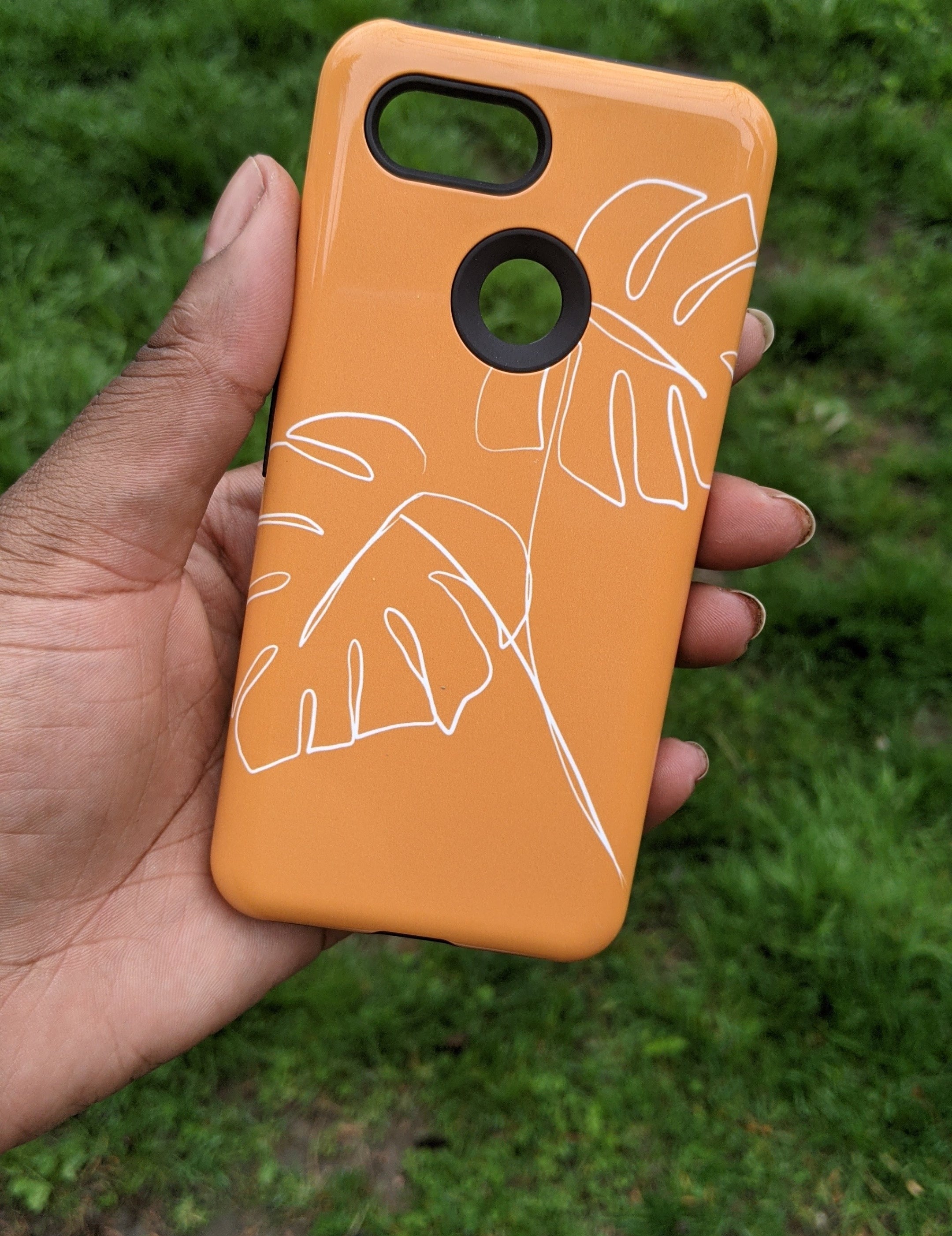 A person holding a phone case