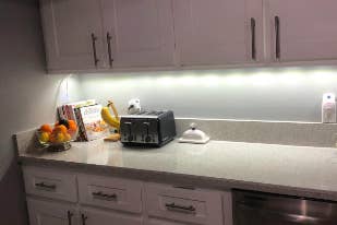 Reviewer's kitchen at night with the cabinets glowing from underneath