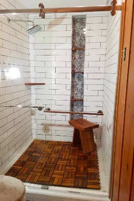 Reviewer's shower in with the tiles on the bottom 