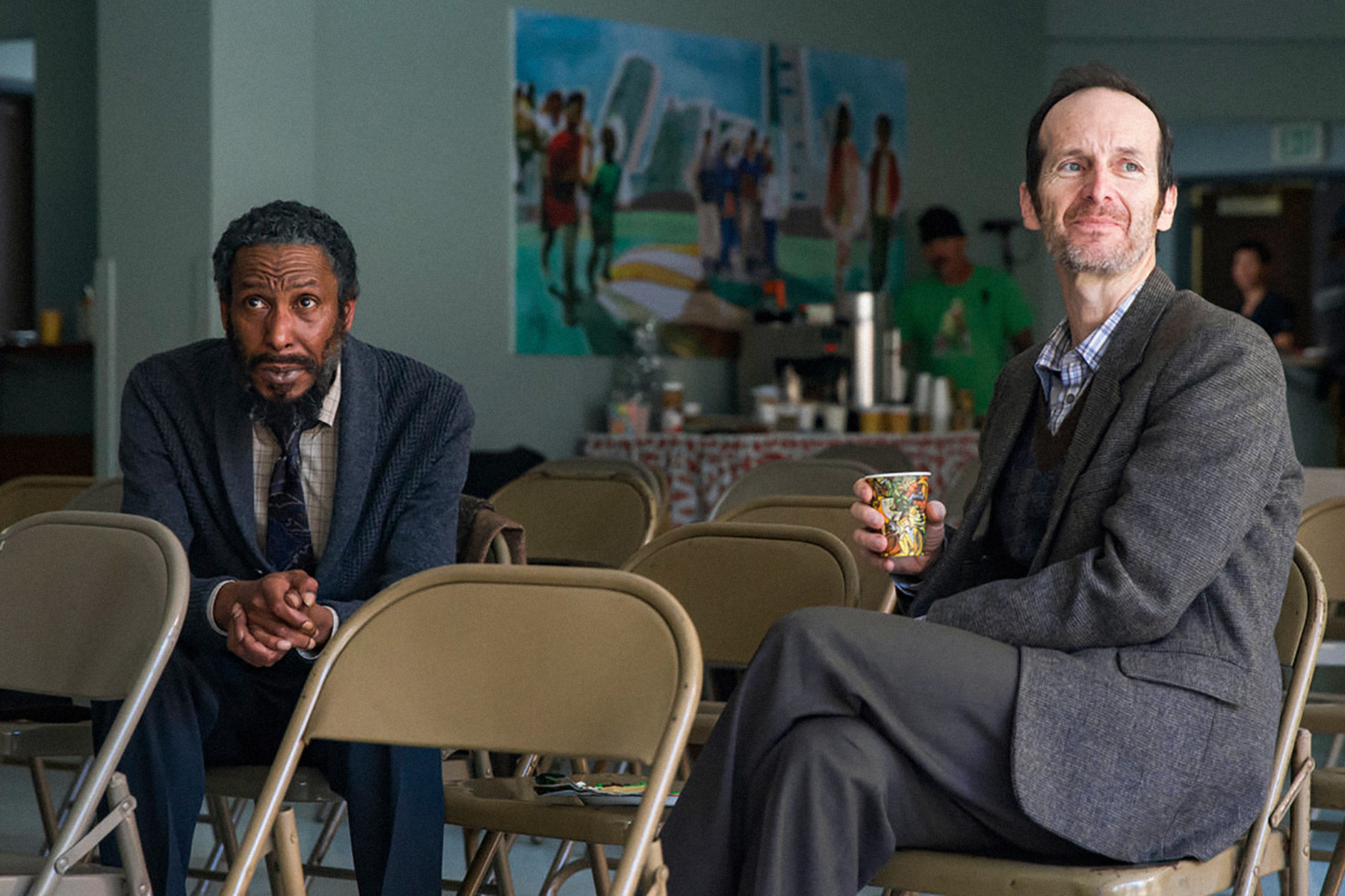 Ron Cephas Jones and Denis O&#x27;Hare sitting on folding chairs
