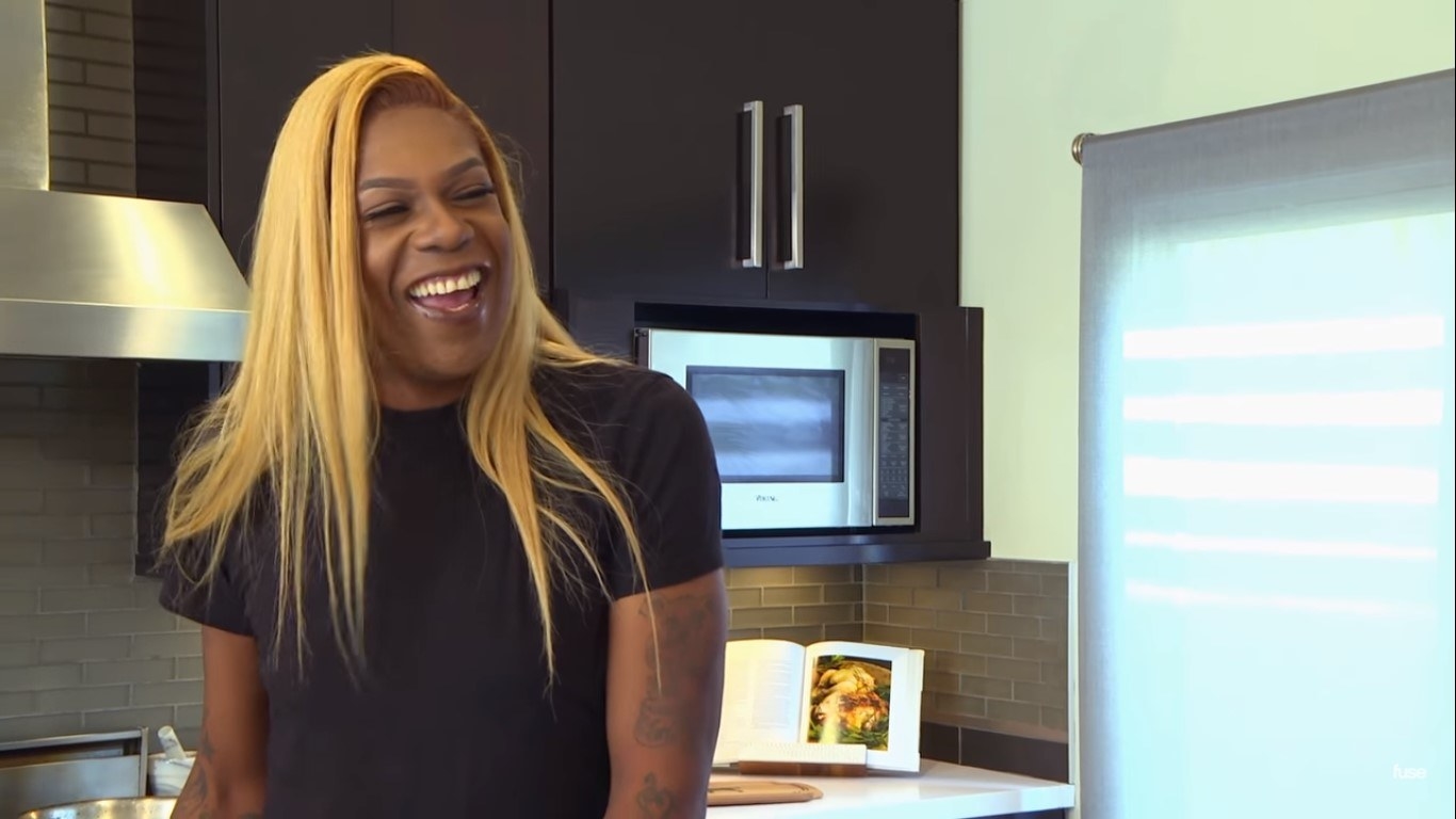 Big Freedia laughing in a kitchen