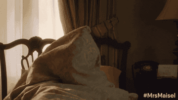 Susie in Marvelous Mrs. Maisel sitting up in bed