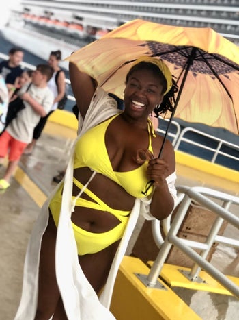 Reviewer wearing the bright yellow swimsuit