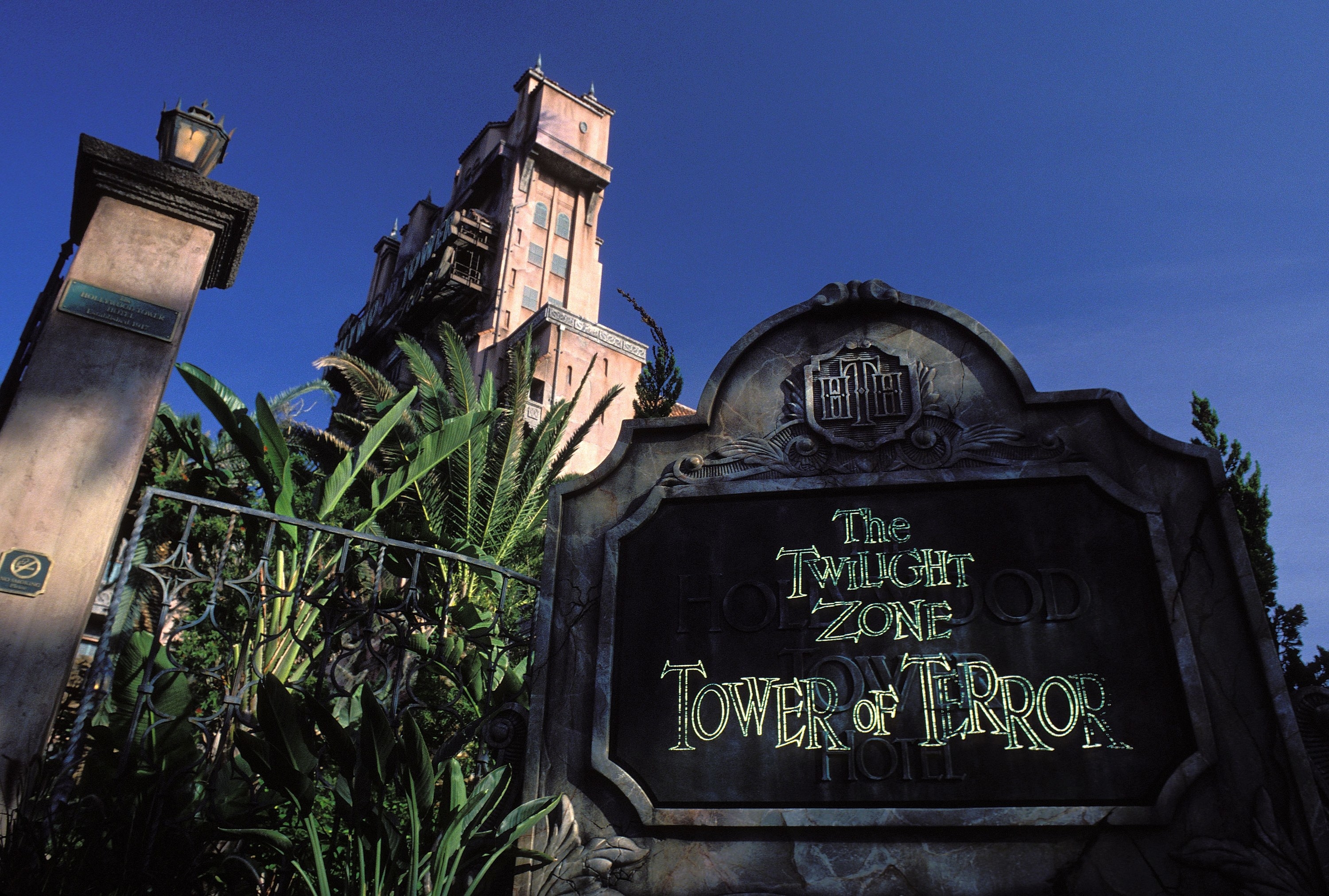 Photo of the Tower of Terror sign with the ride in the background in 1994
