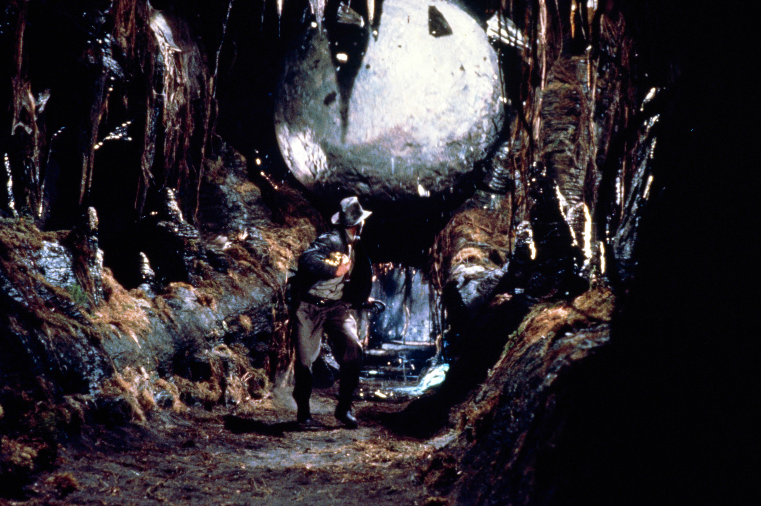 Photo of Indiana Jones running from a giant boulder in a cave