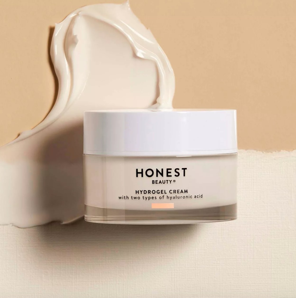 Honest Beauty moisturizer against cream background