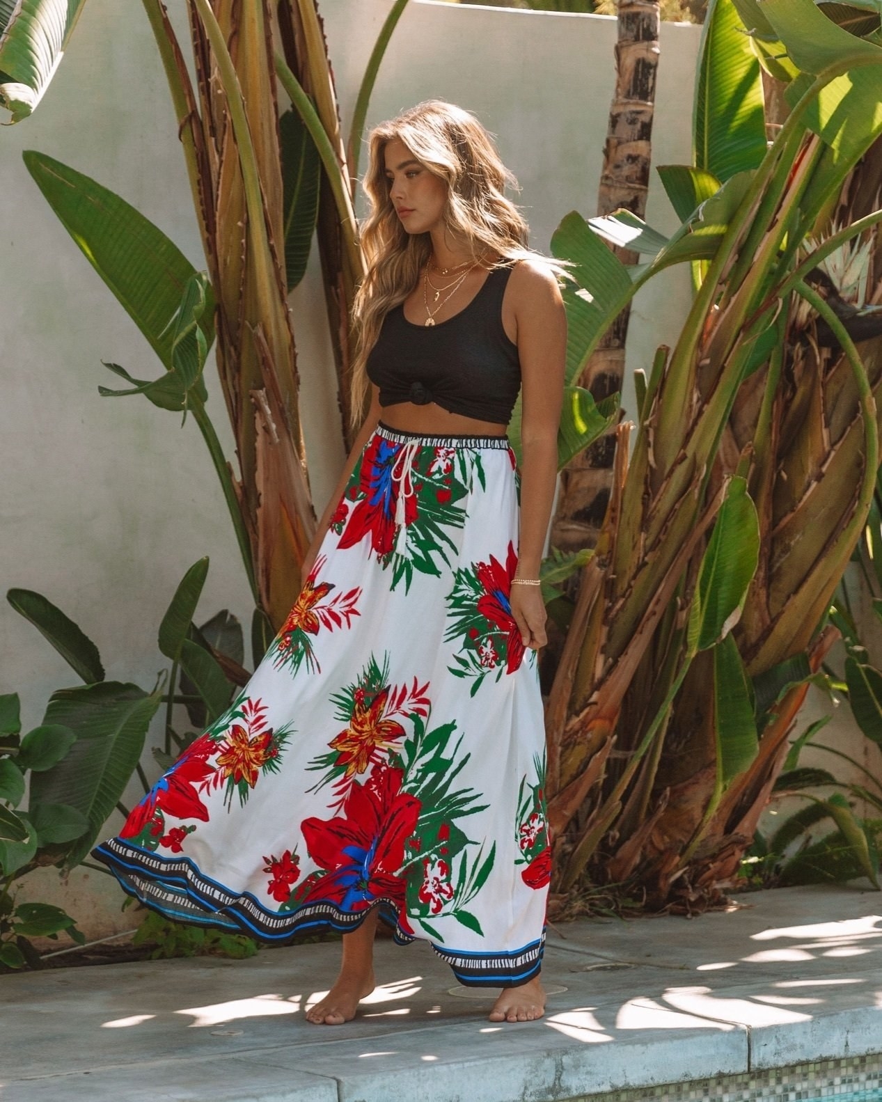 model wearing white maxi skirt with floral design 