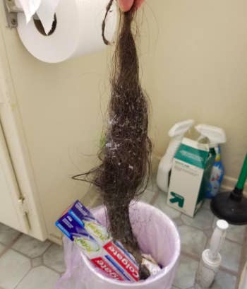 A customer review photo of all the hair in their drain