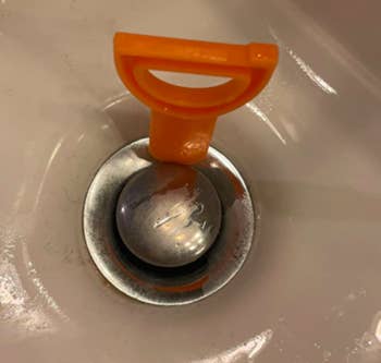 A customer review photo of the tool down their drain