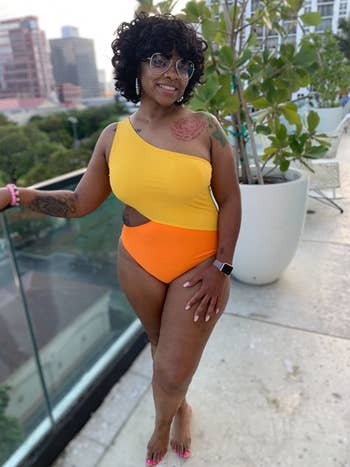 Reviewer wearing orange and yellow bathing suit