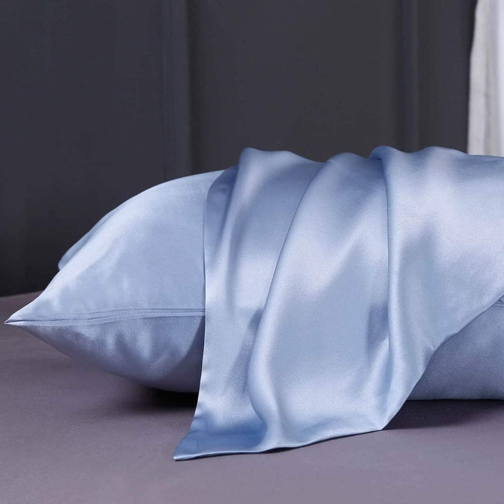 a silk pillow case draped over a pillow