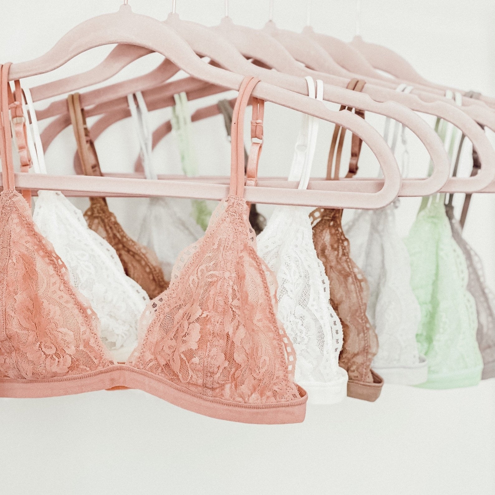 triangle lace bralettes in peach, white, tan, mint, and grey