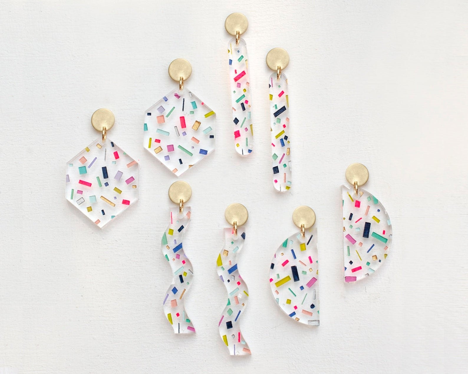 the confetti earrings in different shaped with round gold studs at the top