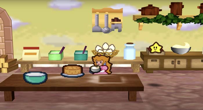Princess Peach getting ready to frost her cake in the kitchen