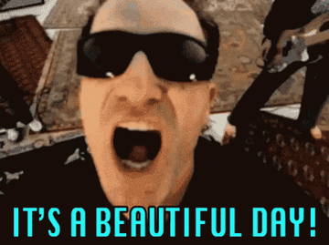 GIF of Bono singing &quot;It&#x27;s A Beautiful Day&quot; from the music video for Beautiful Day