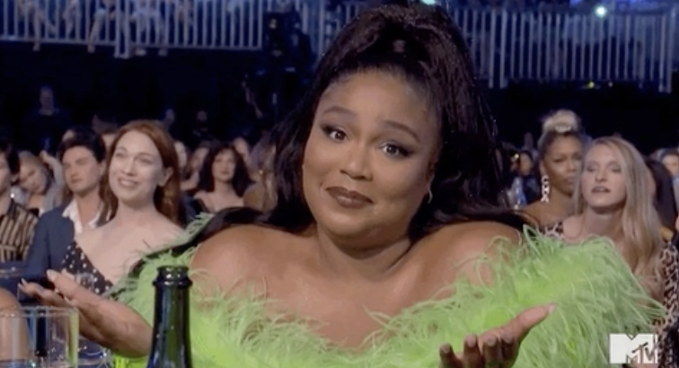 Lizzo shrugging her shoulders at the camera at the MTV Awards in 2019