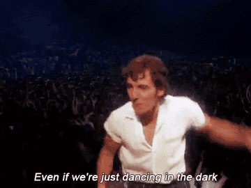 GIF of Bruce Springsteen dancing in the &quot;Dancing in the Dark&quot; video