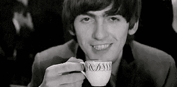 GIF of George Harrison sipping tea and lifting his brow