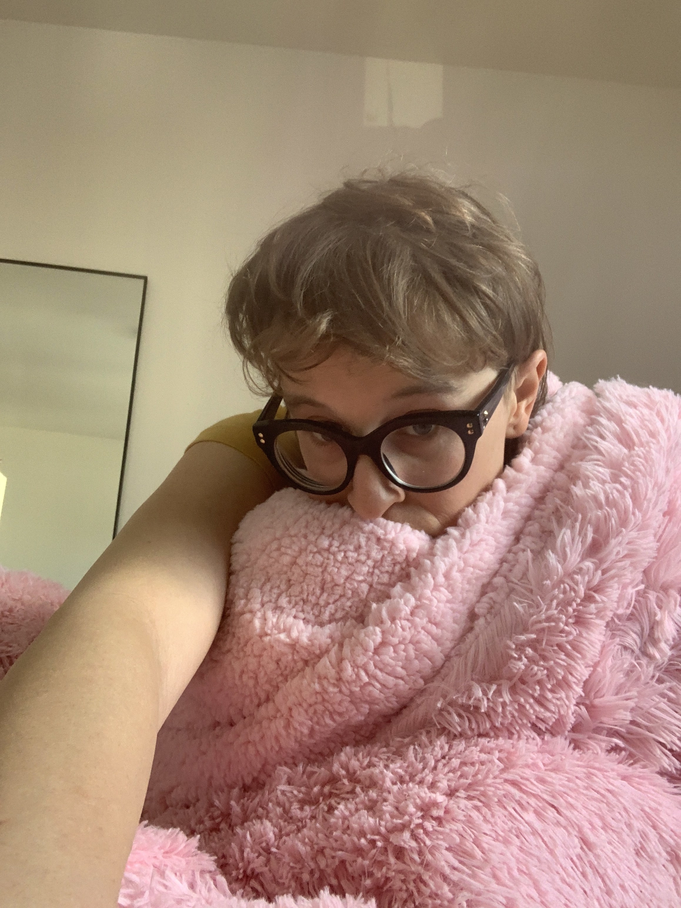 The author under the pink two-sided blanket