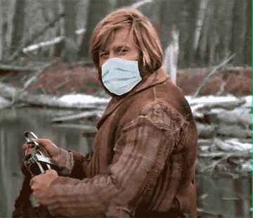 Robert Redford in "Jeremiah Johnson," nodding with a surgical mask photoshopped on his face