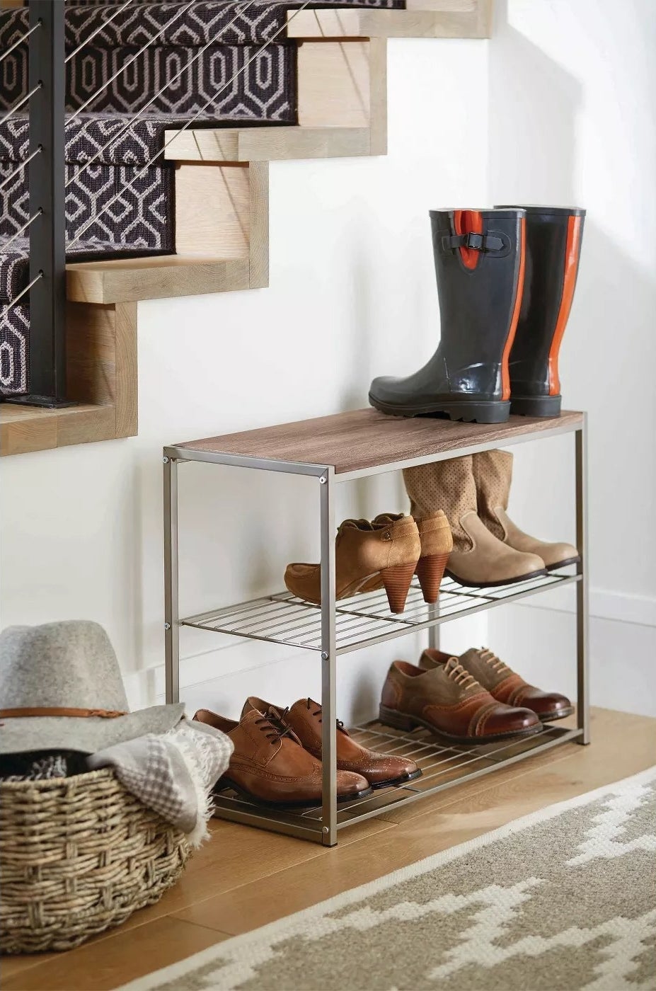 The shoe rack with three tiers and a wooden top in an entryway