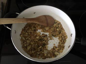 Reviewer's mushrooms cooking in a pan 