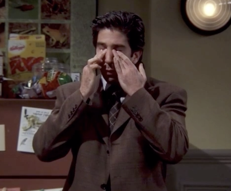 Ross Geller from &quot;Friends&quot; holding his fingers to his eyes in frustration
