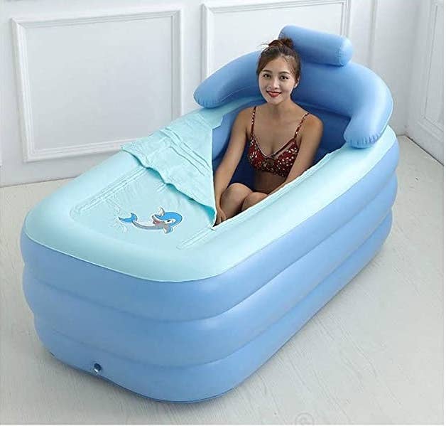 A person sitting inside the tub.