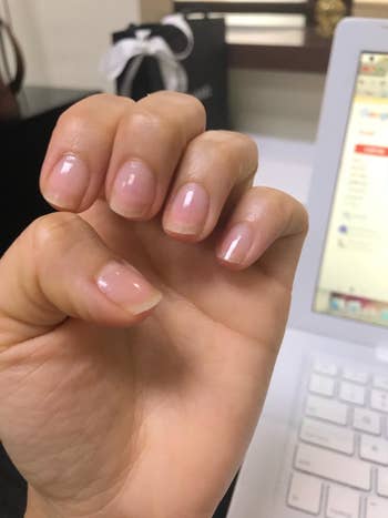 reviewer's before pic of their nails 