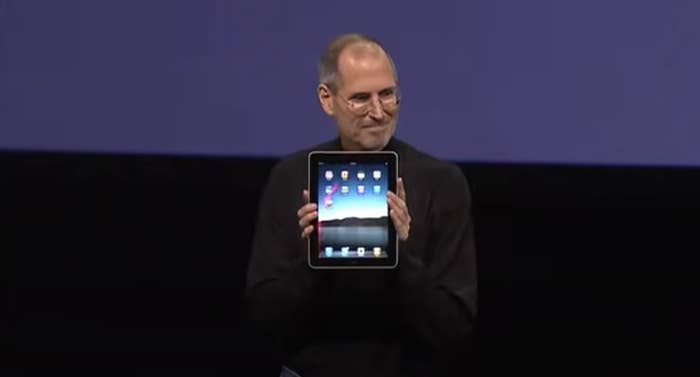 Steve Jobs holds up the very first iPad at the Apple release event in 2010