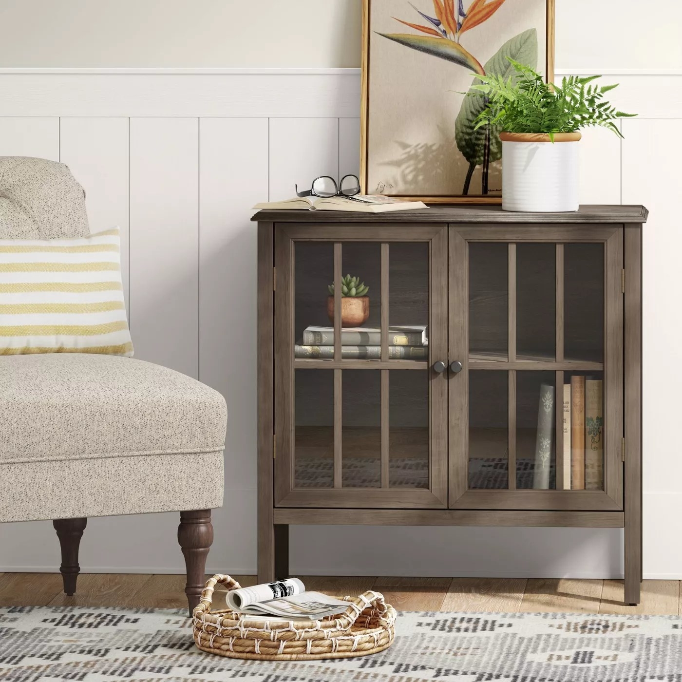 The accent cabinet with two glass doors in a living room