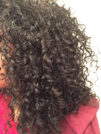 Reviewer with curls from the diffuser 