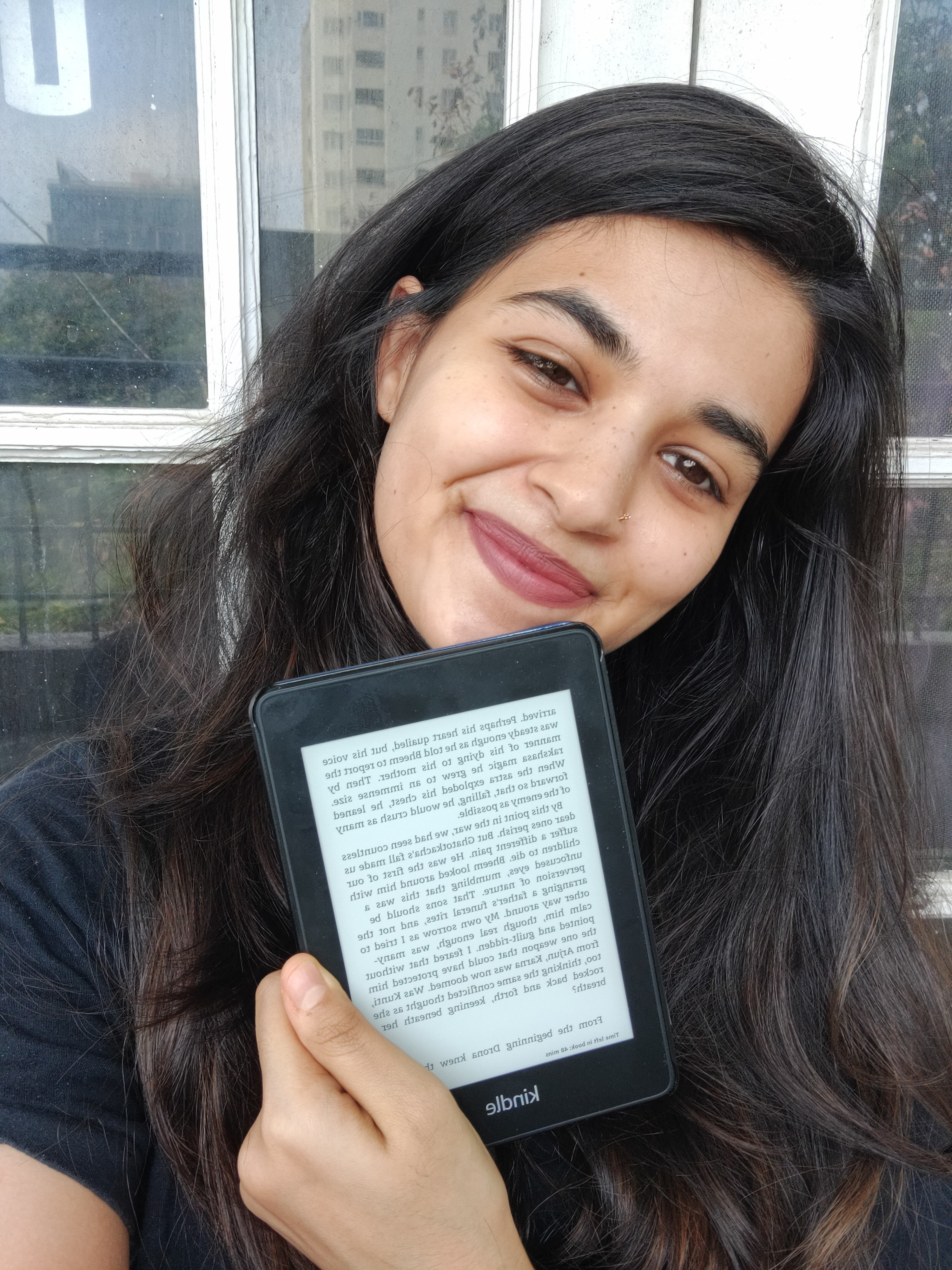 A photo of me holding the Kindle