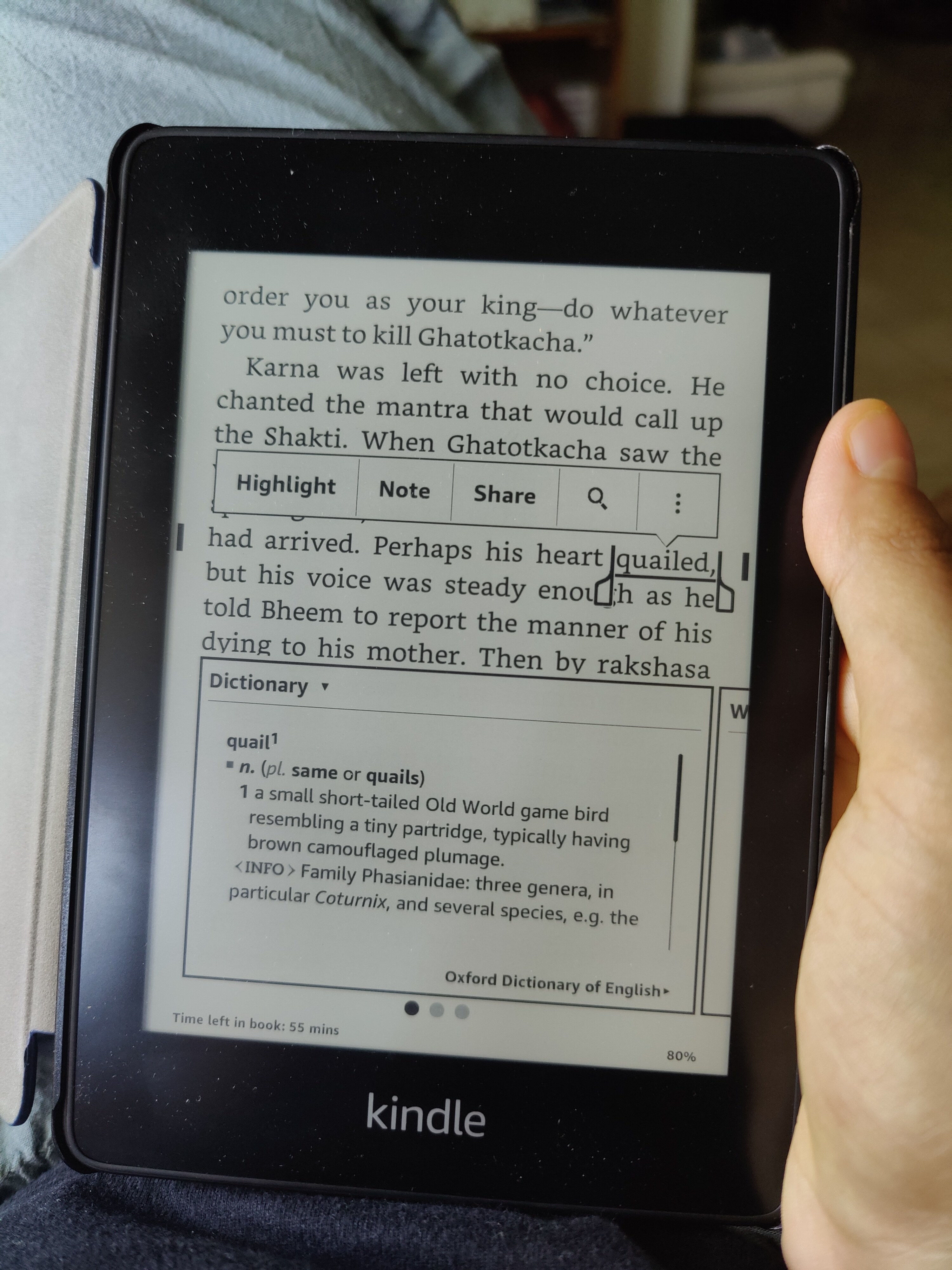 The word &#x27;quail&#x27; has been highlighted on the Kindle, and the inbuilt dictionary is displaying its meaning.