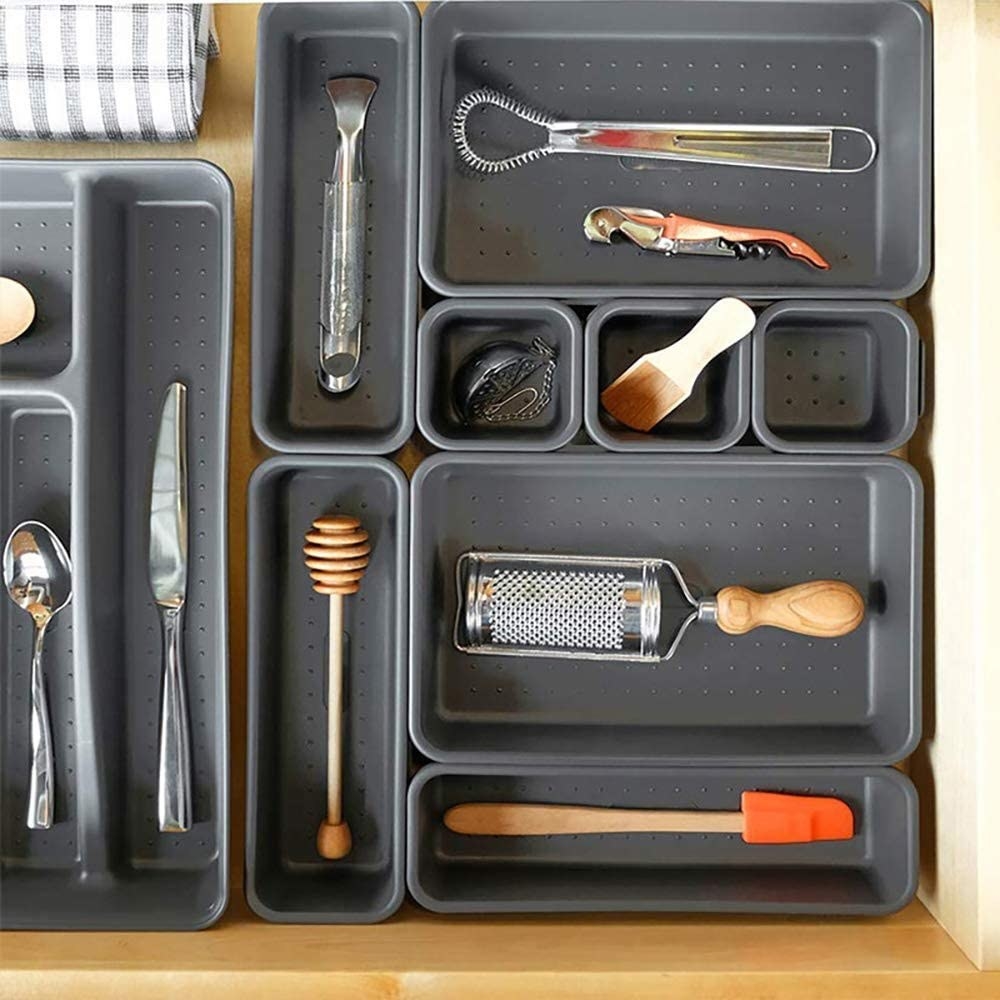 A drawer organiser with items in it 