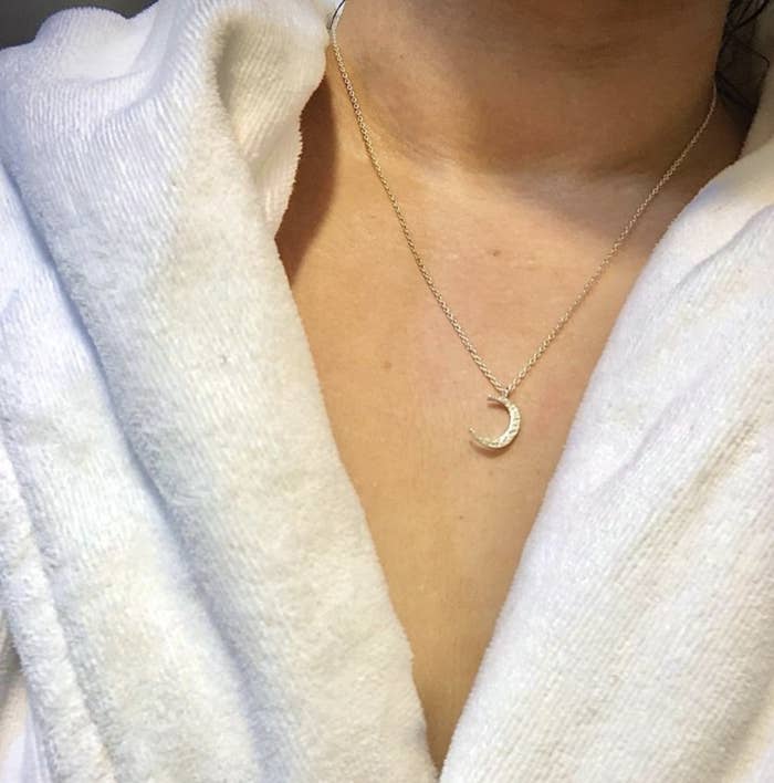 reviewer wearing crescent moon necklace