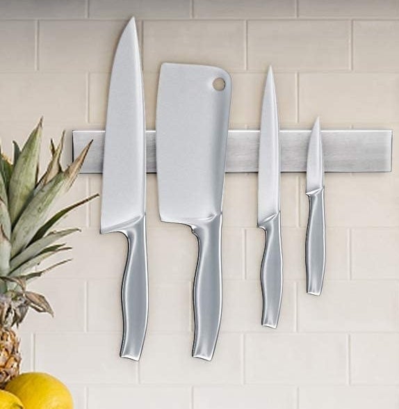 Knives hanging off of the magnetic bar