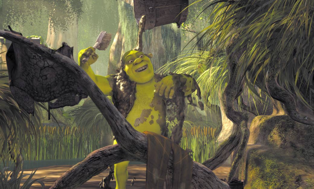 Shrek showers with a bucket of mud in a swamp