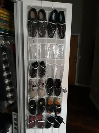 reviewer's clear over the door shoe organizer with shoes in it
